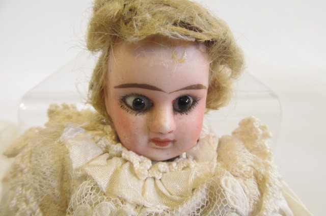 An Armand Marseille bisque head and shoulders doll Image