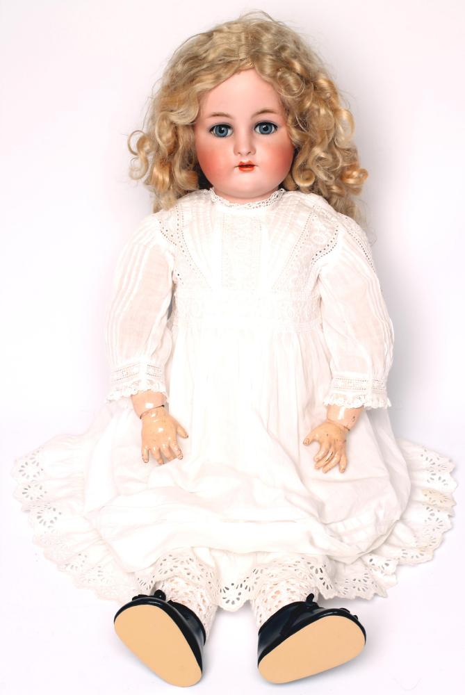 A Kammer & Reinhardt bisque head doll with blue glass sleeping eyes Image