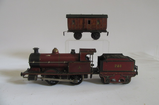 Marklin Clockwork 0-4-0 M.R. locomotive and tender and a small G.N.R. coach Image
