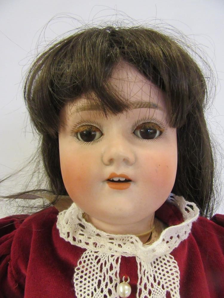 An A. Schoenau & Hoffmeister bisque head doll Image