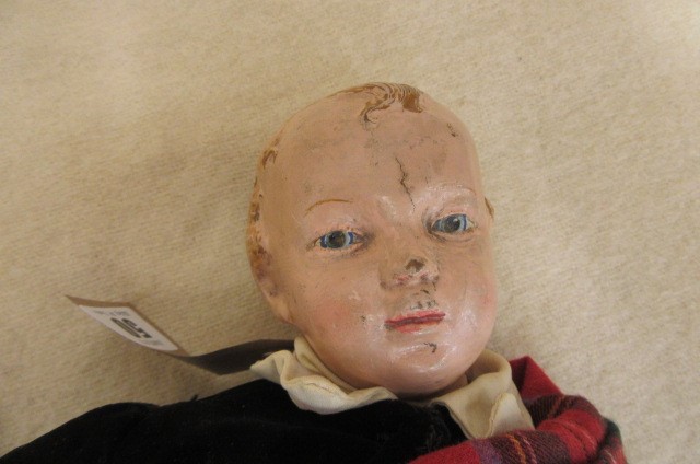 An Albert Schoenhut all wood boy doll with carved painted face and hair Image