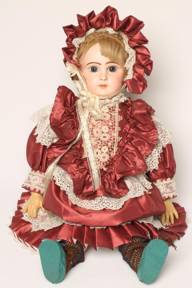 A Tete Jumeau bisque head doll with fixed blue glass eyes Image