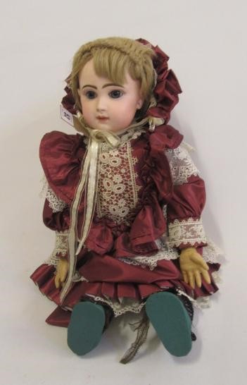 A Tete Jumeau bisque head doll with fixed blue glass eyes Image
