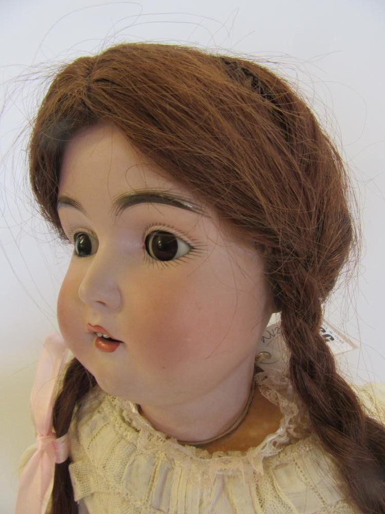 A J D Kestner bisque head doll with brown glass sleeping eyes Image