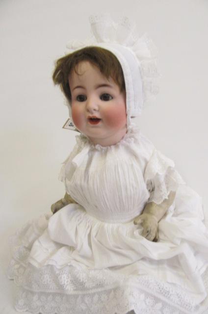 An Alt Beck & Gottschalck bisque head doll with brown glass sleeping eyes Image