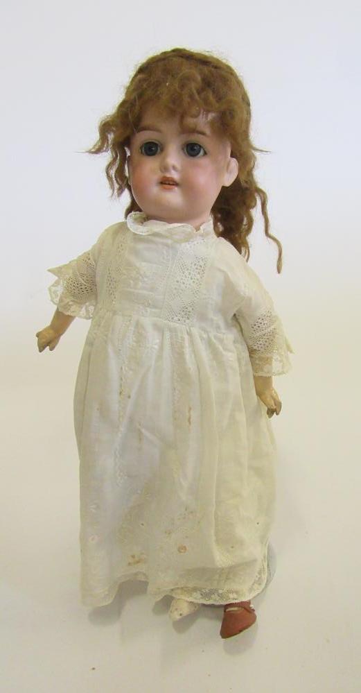 An Armand Marseille Floradora bisque head doll with blue glass sleeping eyes Image