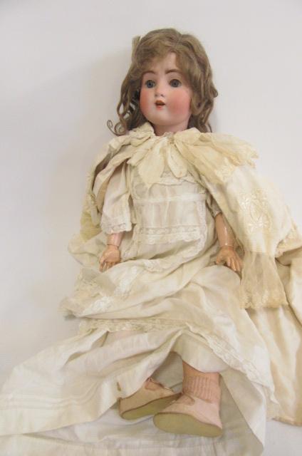 An Alt Beck & Gottschalck bisque head doll with blue glass sleeping eyes Image
