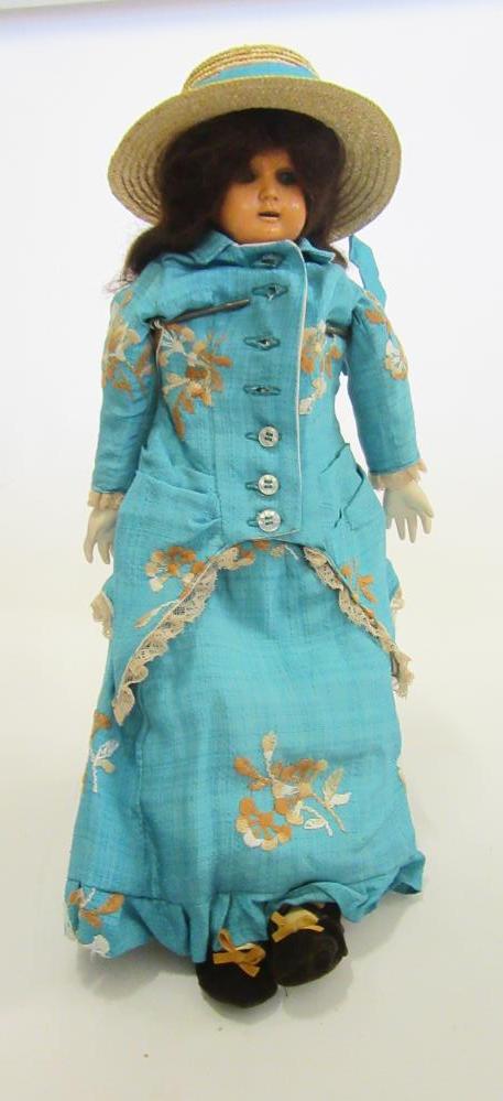 A Bruno Schmidt celluloid shoulder head doll with blue glass sleeping eyes Image