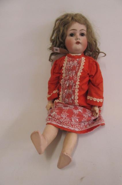 A Kammer & Rheinhardt bisque head walking doll with cry Image
