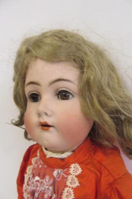A Kammer & Rheinhardt bisque head walking doll with cry Image