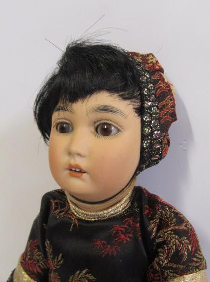 A German bisque head Oriental doll Image