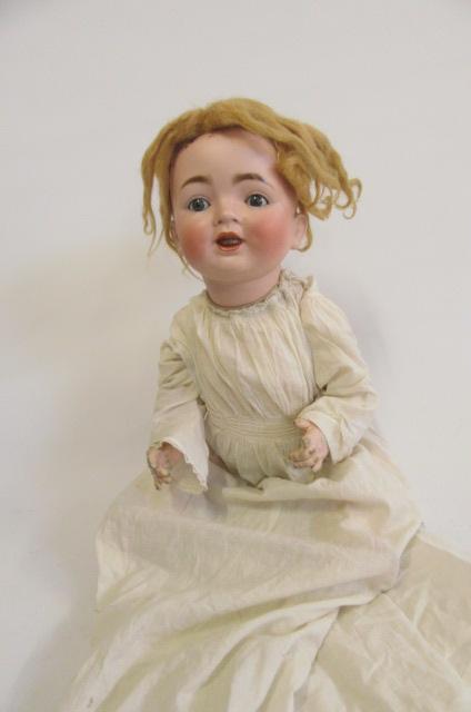 A Caterfelder Puppenfabrik bisque head character doll with blue glass sleeping eyes Image