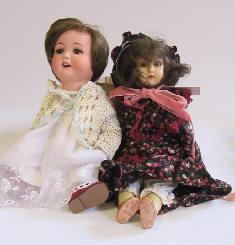 An Armand Marseille bisque head character doll with brown glass sleeping eyes Image