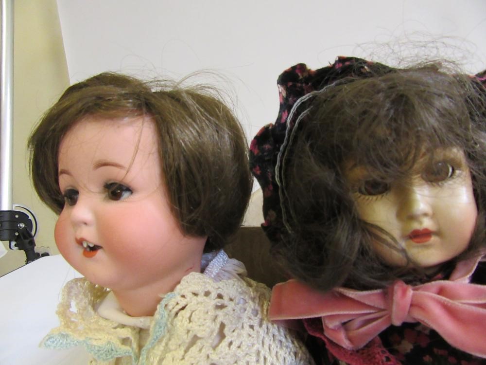 An Armand Marseille bisque head character doll with brown glass sleeping eyes Image