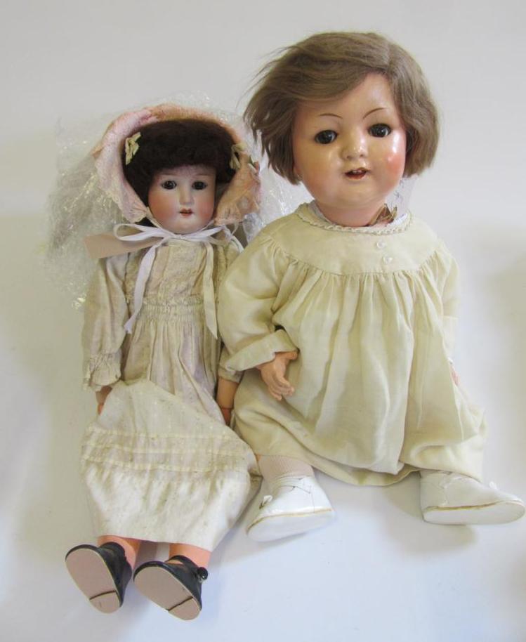 An Ernst Heubach bisque head doll with brown glass sleeping eyes Image