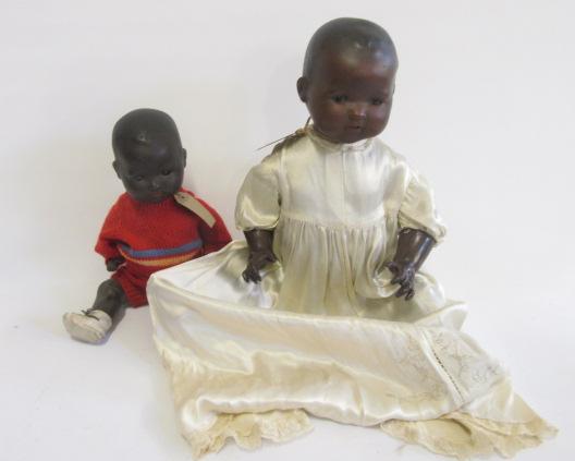 Two Armand Marseille black baby dolls with bisque heads Image