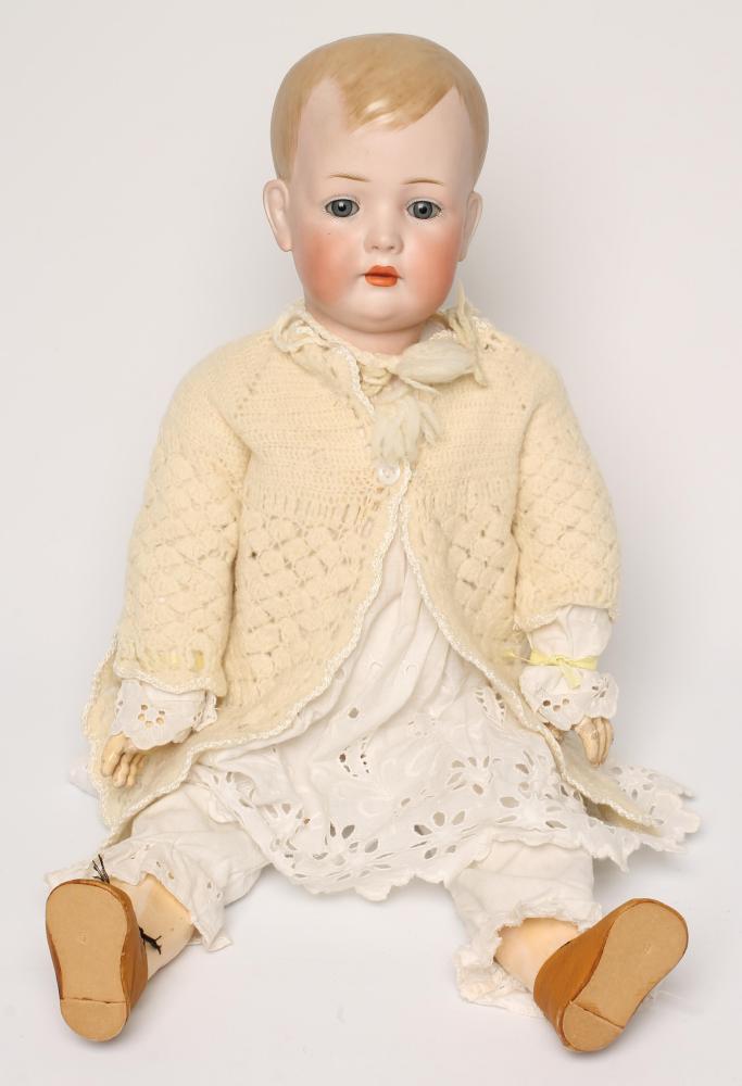 A Bruno Schmidt bisque head boy doll with blue glass sleeping eyes Image