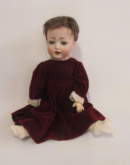 A Kestner bisque head character doll with blue glass sleeping eyes Image