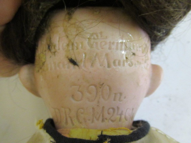 Three bisque socket head dolls Image