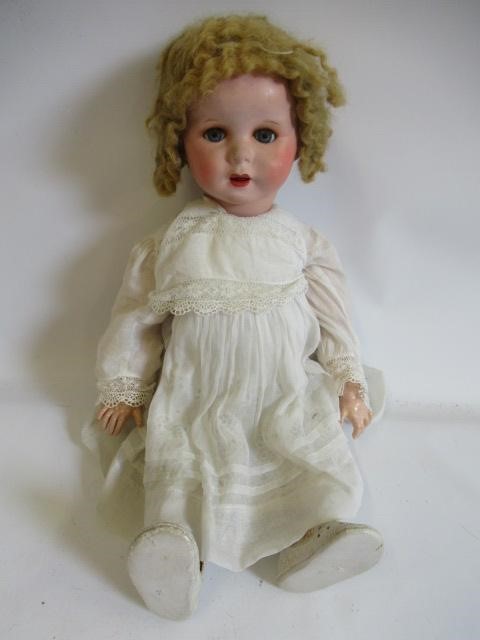 Four compositon head dolls Image