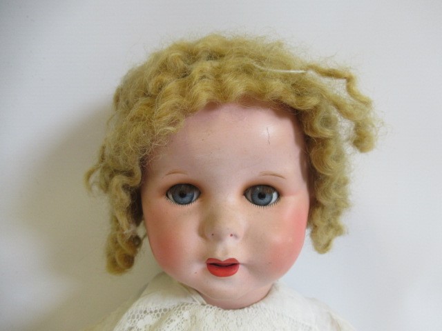 Four compositon head dolls Image