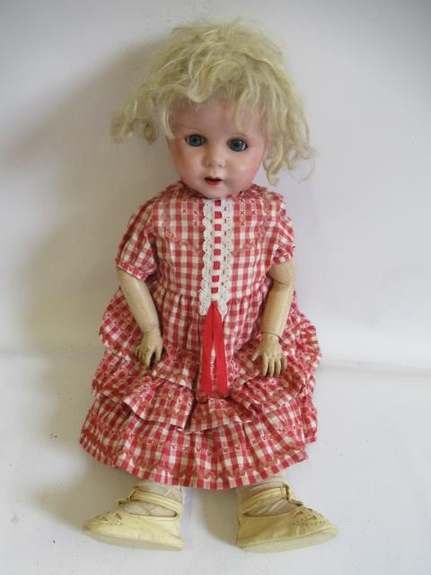 Four compositon head dolls Image