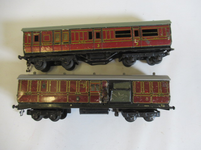 Two playworn Carrette L.M.S. coaches comprising brake end and T.P.O., P (Est. plus 24% premium inc. Image