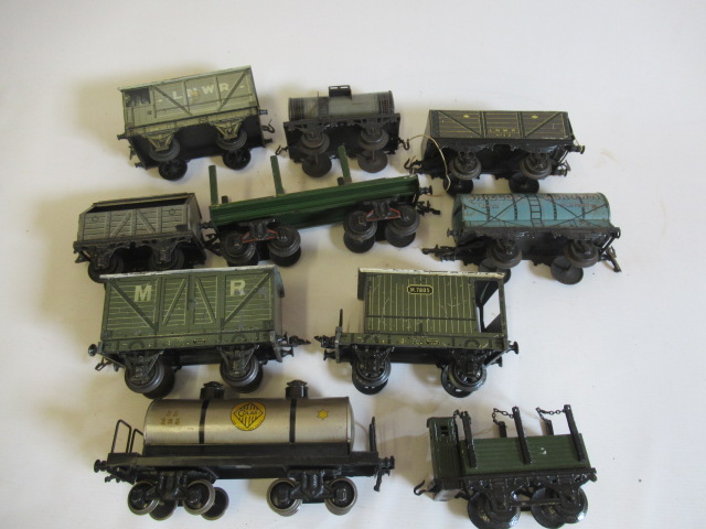 Gauge 1 goods rolling stock by Bing and others including tank wagons, covered vans and brake van, F Image