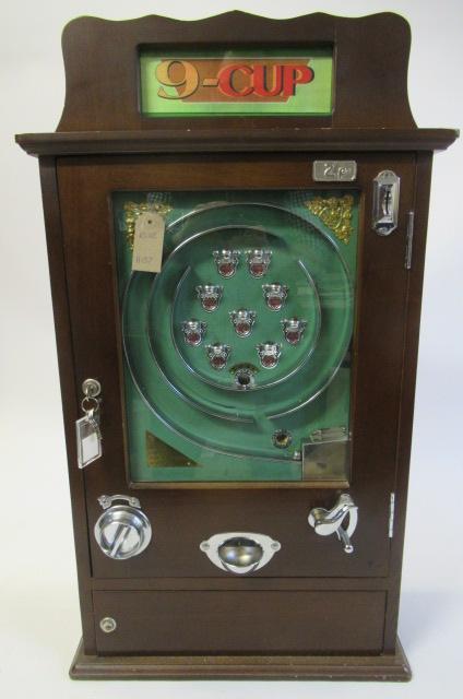 Modern Issue nine cup slot machine game, wooden case with chrome metal parts, E (Est. plus 24% Image