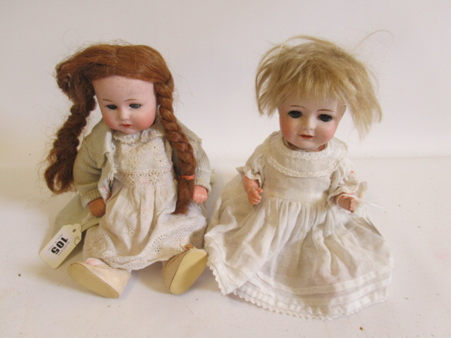Two Heubach bisque socket head 10537 dolls, comprising one 11 1/2" doll and one 10 1/2", both with Image
