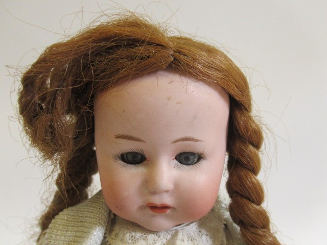 Two Heubach bisque socket head 10537 dolls, comprising one 11 1/2" doll and one 10 1/2", both with Image