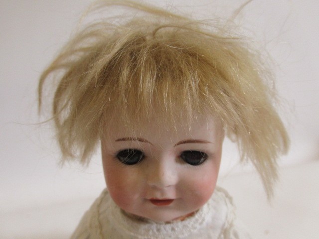 Two Heubach bisque socket head 10537 dolls, comprising one 11 1/2" doll and one 10 1/2", both with Image