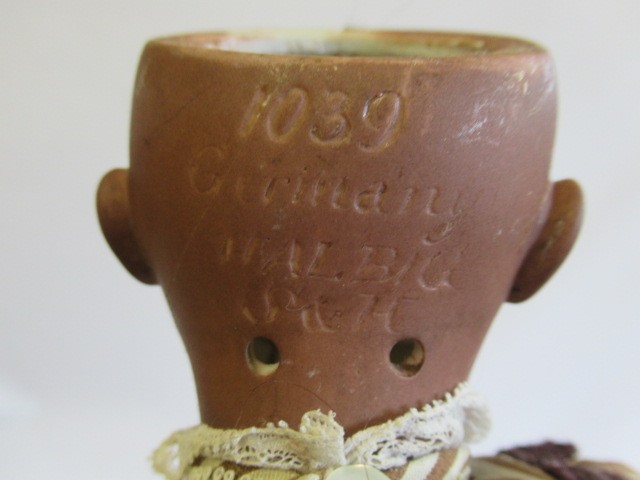 Three restored bisque socket head dolls Image