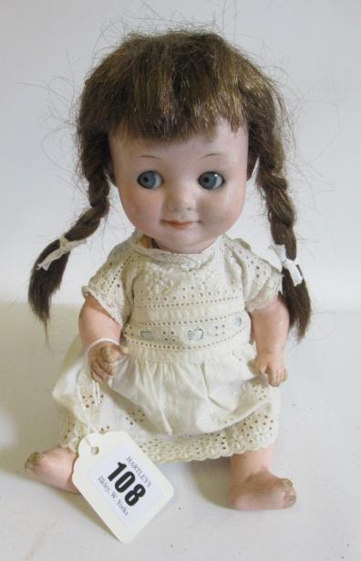 An Armand Marseille Googly eye doll, with blue glass fixed eyes, closed mouth, bent limb composition Image