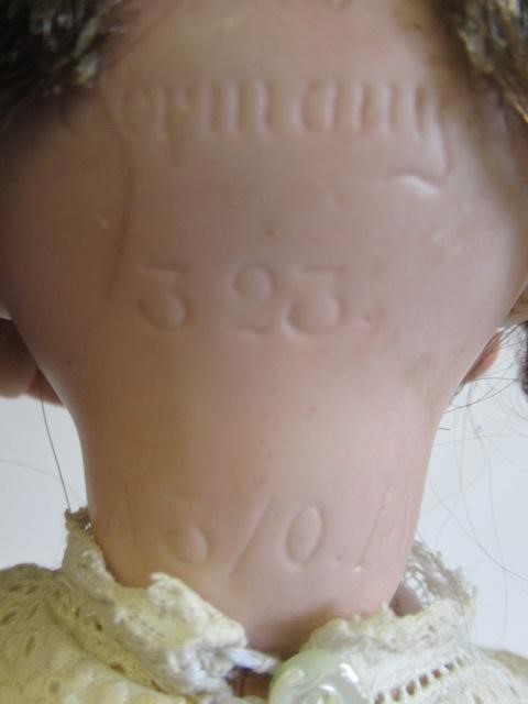 An Armand Marseille Googly eye doll, with blue glass fixed eyes, closed mouth, bent limb composition Image