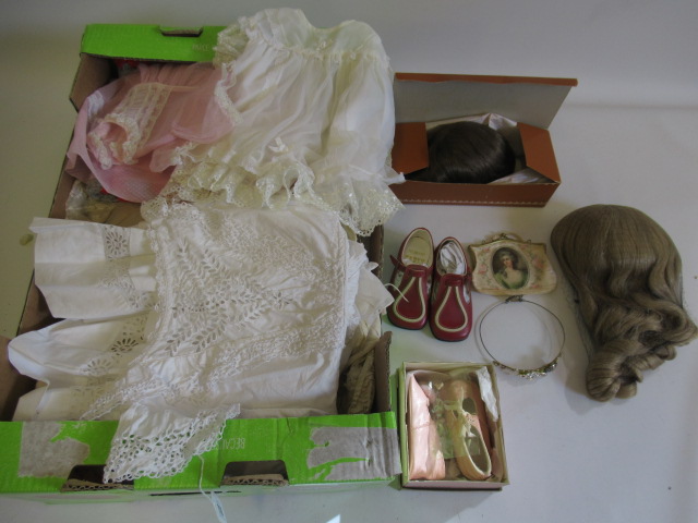 A large quantity of doll accessories, including two boxed Monique wigs, three other real hair wigs, Image
