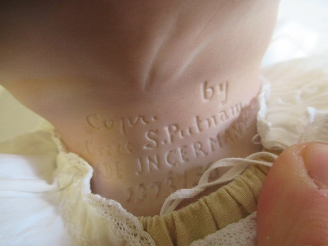 A Grace Putnam bisque flange neck bye-lo-baby doll Image