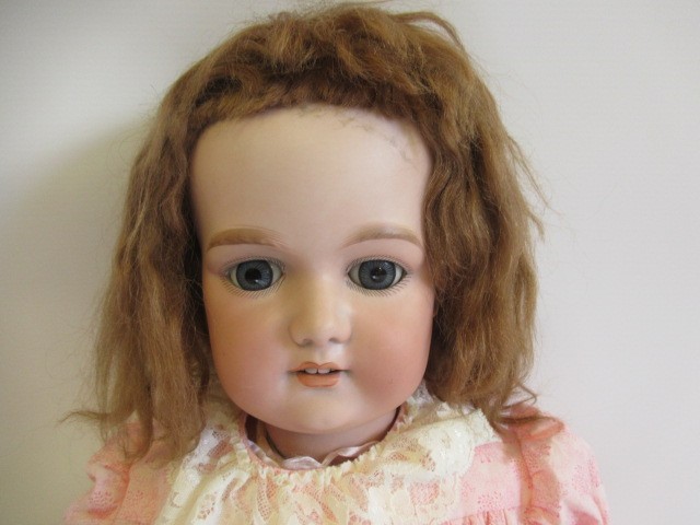A large Armand Marseille bisque socket head doll Image