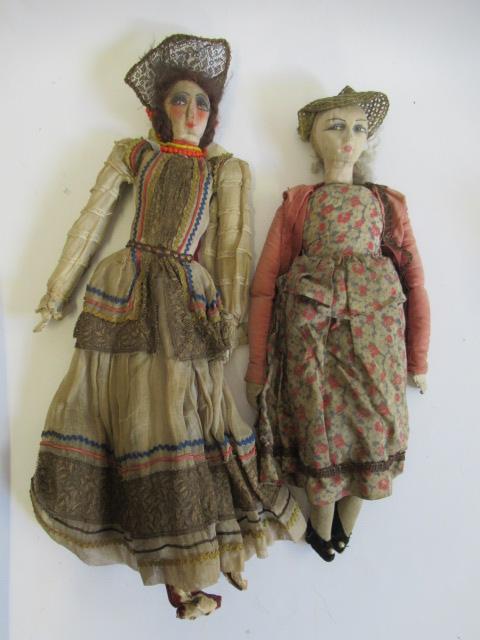 Two vintage fashion dolls, with cloth heads, painted features including sideways glancing eyes, Image