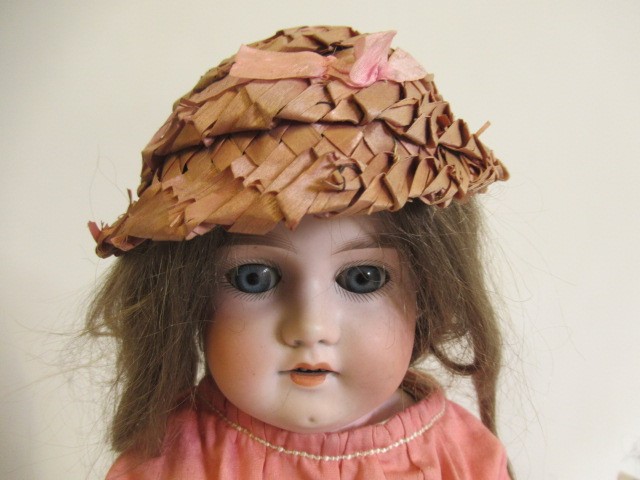 An Armand Marseille bisque shoulder head doll Image
