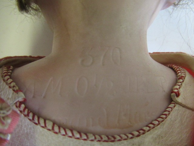 An Armand Marseille bisque shoulder head doll Image