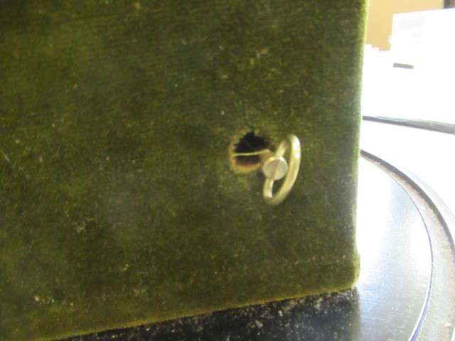 A bisque head automaton doll under dome Image