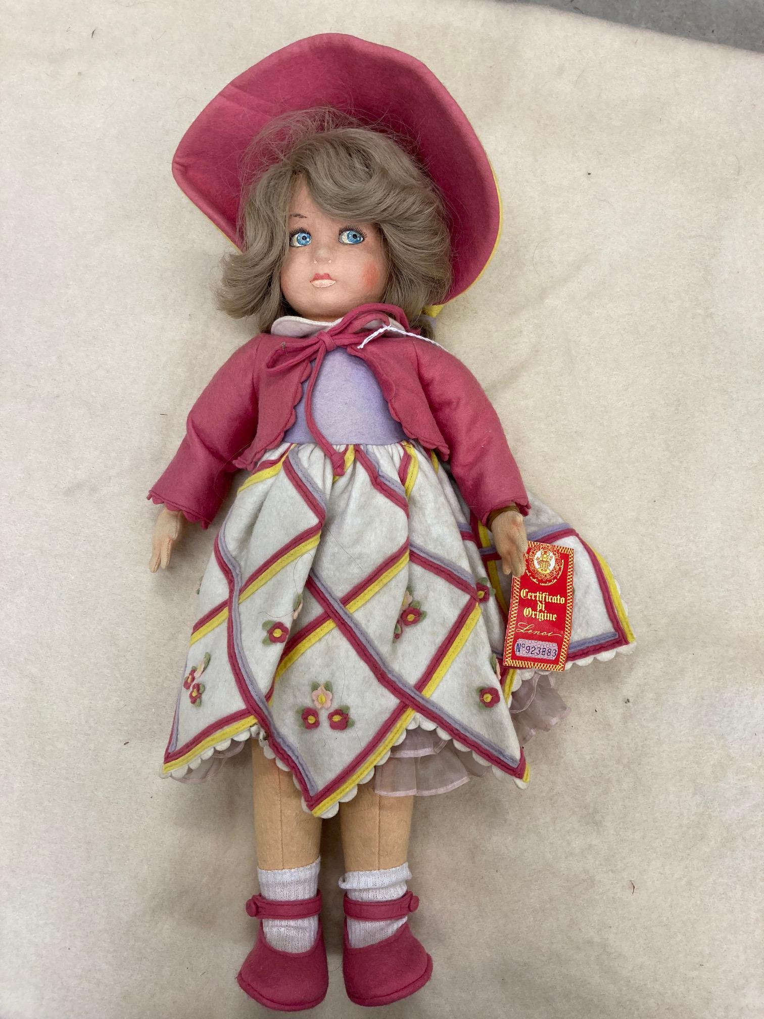 A Lenci girl doll, with felt face and body, painted features, real hair, original outfit, bonnet and Image
