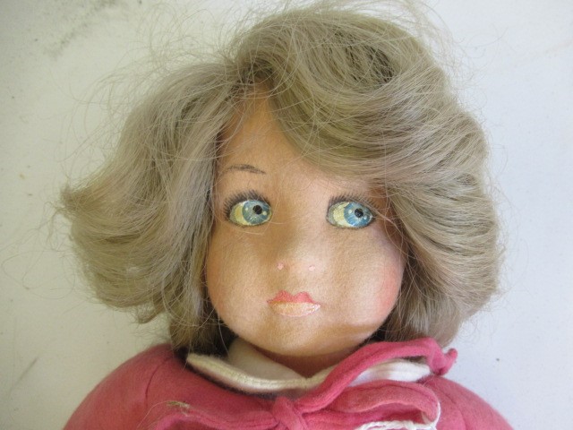 A Lenci girl doll, with felt face and body, painted features, real hair, original outfit, bonnet and Image