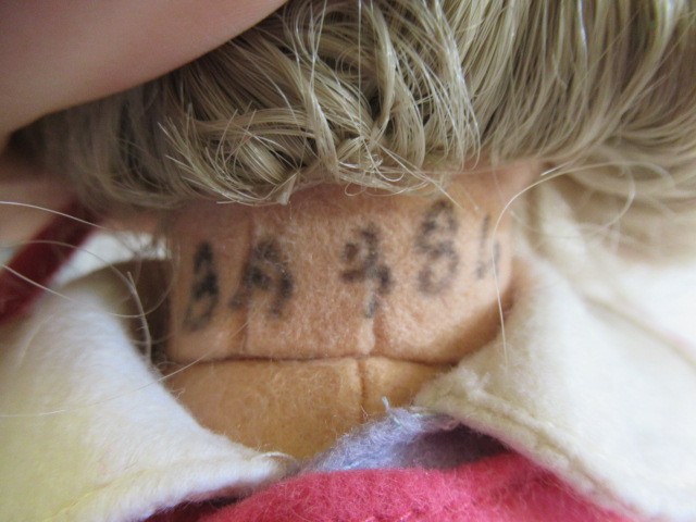 A Lenci girl doll, with felt face and body, painted features, real hair, original outfit, bonnet and Image