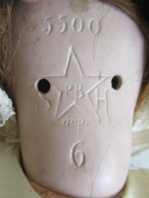 A Schoenau & Hoffmeister bisque socket head doll Image