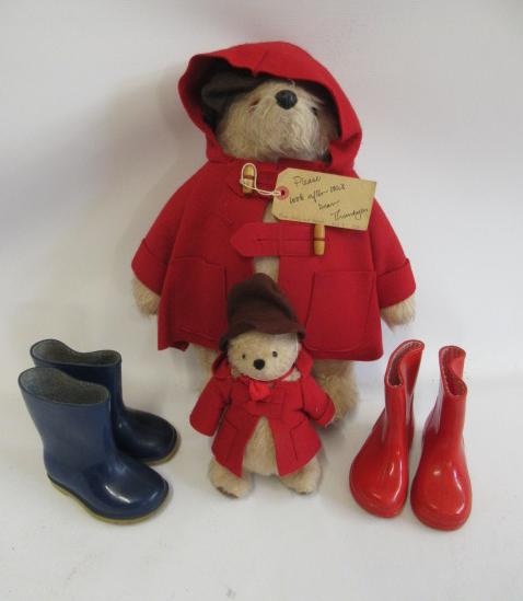 Paddington bear, with brown felt hat, red coat, label and a pair of blue Dunlop boots, together with Image