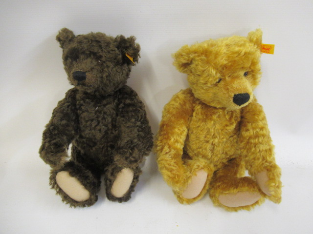 Two Steiff bears, comprising a 13 1/3" brown growling bear and a 13 1/2" bear with orange plush, Image