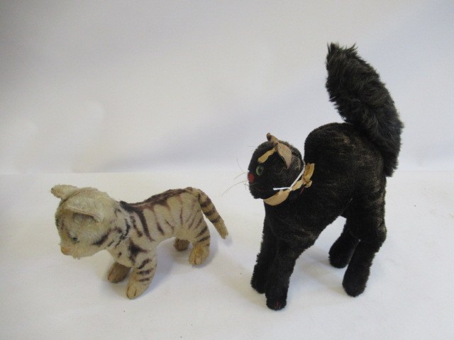 Two Steiff cats, comprising a tabby with green glass eyes and a 1950s Schwarzer Kater with silver Image