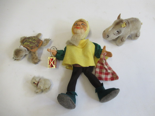 Three Steiff items, comprising a 27cm Happy Dwarf, a 14cm Slo with silver button, and a rhino with Image